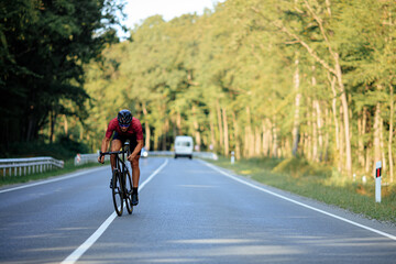 Fototapeta premium Active man in sport clothing riding bike outdoors