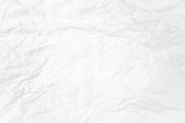 white and gray crumpled paper texture background. crush paper so that it becomes creased and...