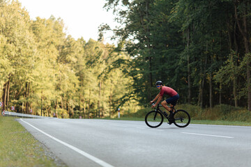 Fototapeta premium Healthy young man using bike for riding on fresh air
