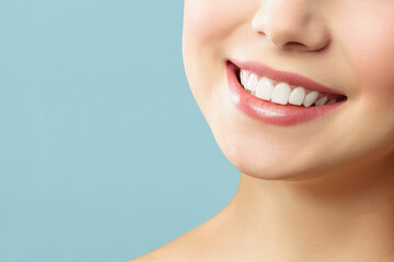 Perfect healthy teeth smile of a young woman. Teeth whitening. Stomatology concept.