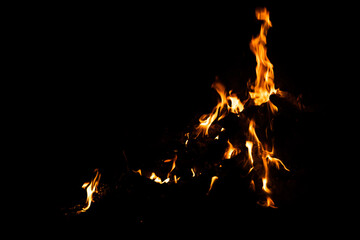 Fire flames on black background. fire burst texture for banner backdrop.