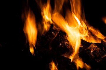 Fototapeta premium Fire flames on black background. fire burst texture for banner backdrop.