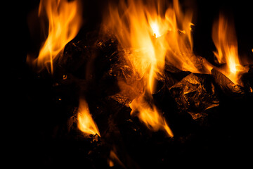 Fire flames on black background. fire burst texture for banner backdrop.