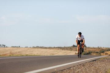 Enduring man practising in cycling during morning time