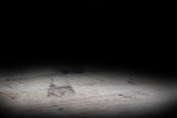 Wood table and black wall background, Empty wooden floor space platform with library background for product display.