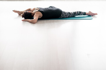Young beautiful woman practicing yoga. Wellness concept. Calmness and relax, woman happiness. Toned picture