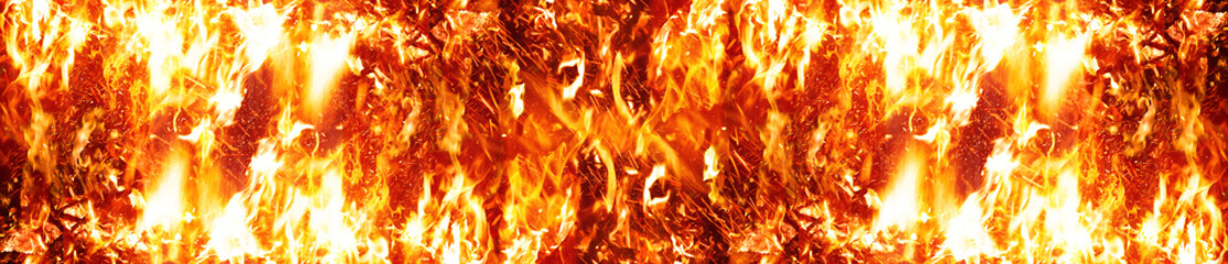 Fototapeta premium Long Fire flames on black background. fire burst texture for banner backdrop.