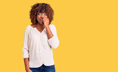 Young african american woman wearing casual clothes looking stressed and nervous with hands on...