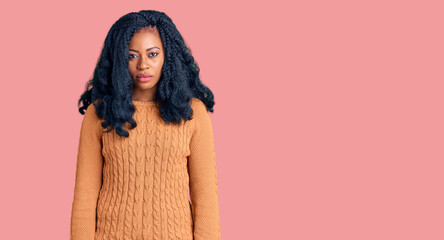 Beautiful african american woman wearing casual  sweater depressed and worry for distress, crying...