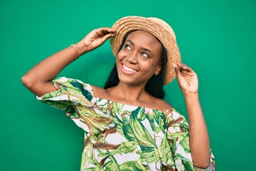 Young african american tourist woman on vacation smiling happy walking at the city.