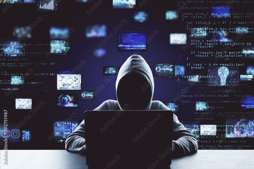Poster Hacker using laptop computer with digital business interface hologram.