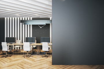 Minimalistic coworking office interior large clock on the wall.