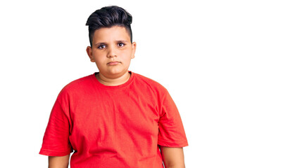 Little boy kid wearing casual clothes with serious expression on face. simple and natural looking at the camera.
