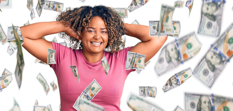 Young african american plus size woman wearing casual clothes relaxing and stretching, arms and hands behind head and neck smiling happy