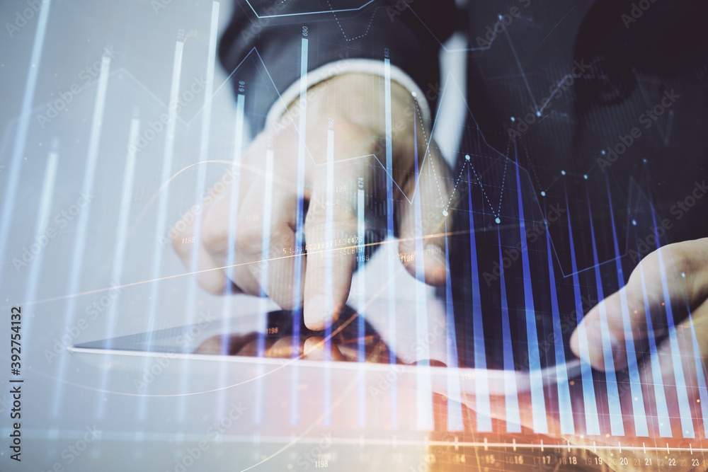 Poster multi exposure of man's hands holding and using a phone and financial chart drawing. market analysis