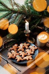 Christmas gingerbread cookies and mug of coffee on a tray