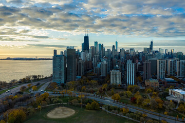 Aerial view of Chicago downtown skyline with park and the beach. Sunrise above big city