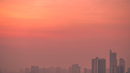 Fototapeta premium Panorama view of panoramic city views, overlooking a wide range of high-rise buildings, blurred breezes, residential distribution (condominiums, offices, expressways)