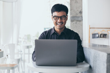 using computer.man hand typing laptop keyboard contact us work online chatting search form internet sitting at office.concept for technology device communication business people