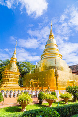 Beautiful golden pagoda with blue sky at Wat Phra Singh, Thailand.