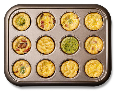 Small egg bite pastry muffins, form for cooking. White background. Finger food and mini food concept. Overhead. Top View