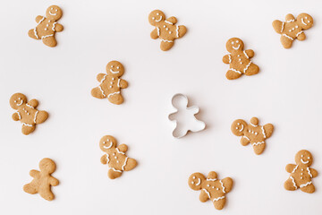 Homemade gingerbread cookies on white background. Christmas, winter, new year composition. Flat lay, top view