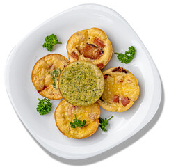Small egg bite with bacon and spinach with parsley on a white square plate on a white background. Isolate