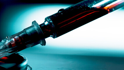 Drug addict prepares another dose of drugs with syringe