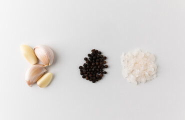 Garlic Peppercorns Salt arranging on isolated white background. Food ingredients of cooking.