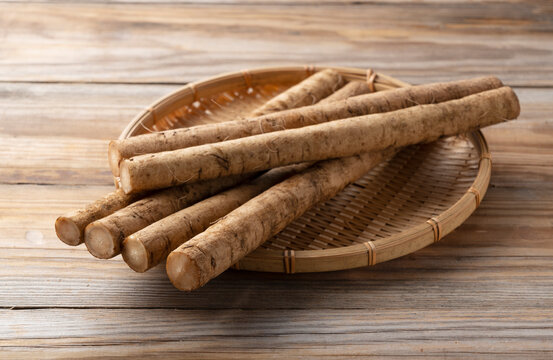 A burdock on a wooden board background