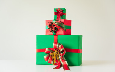 A lot of gift box mockup wrapped decorated with ribbon bow. Big pile of gift set stack on white background color. Merry christmas and Happy new year festival concept.