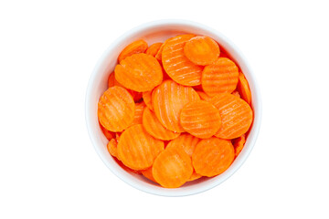 Top view of frozen sliced carrots in a bowl against white background