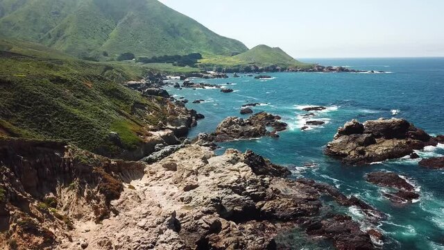 Rock filled coast of Garrapata State Park In California USA north of Big Sur, Aerial dolly out reveal shot