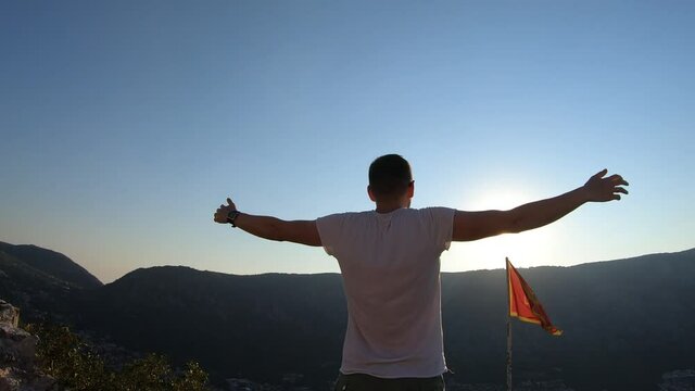 Man standing on top of Fortifications of Kotor, fortress of St. John, Montenegro