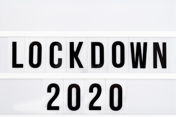 Light box with message lockdown 2020. Word of the Year 2020 is lockdown.