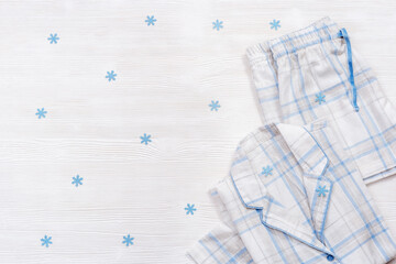 White pajamas, comfortable cotton suit for sleeping, warm shirt and shorts. Homewear for night time decorated snowflakes for winter holiday.