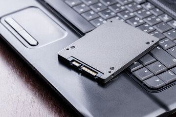 repairing and upgrading laptop computer. new solid state drive on a laptop. computer maintenance...