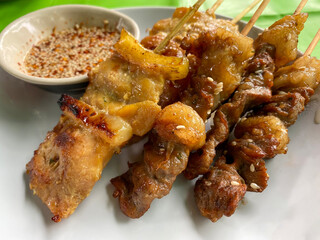 Thai grilled pork and beef skewers with sauce