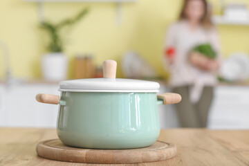 Cooking pot on table in kitchen