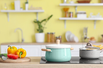 Cooking pots on stove in kitchen