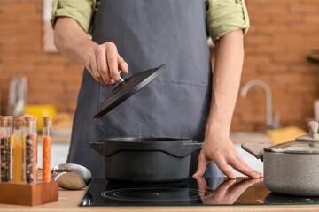 Man cooking dinner in kitchen