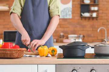 Man cooking dinner in kitchen