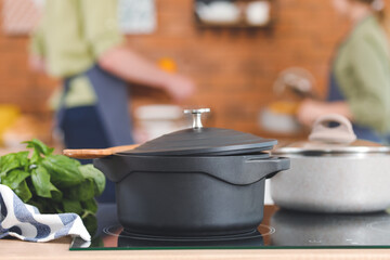 Cooking pots on stove in kitchen