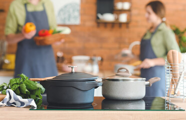 Cooking pots on stove in kitchen