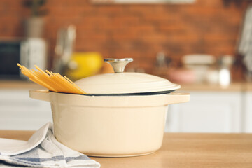 Cooking pot on table in kitchen