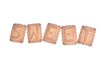 On white clipping background word SWEET laid out from cookies