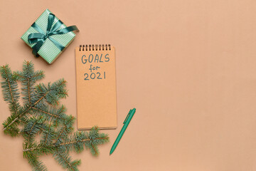 Empty to do list on 2021 year with gift on color background