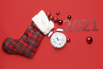 New Year composition with clock on color background