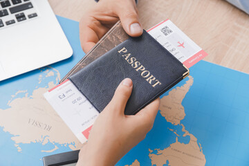 Travel agent giving client documents for future trip in office