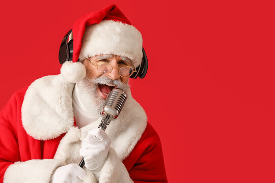 Cool Santa Claus with microphone singing Christmas song on color background